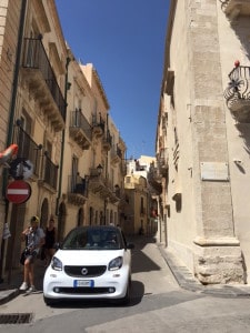 Car in narrow street Ortigia, Siracusa, Sicily
