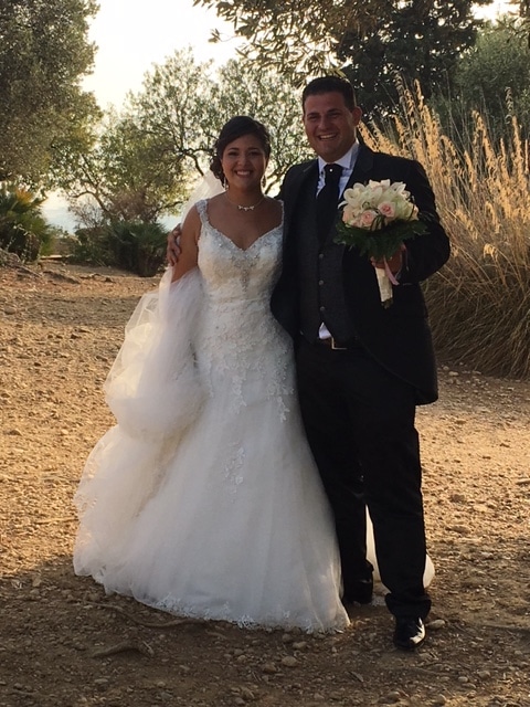 Smiling bride and groom in the Valley of Temples, Agrigento, Sicily