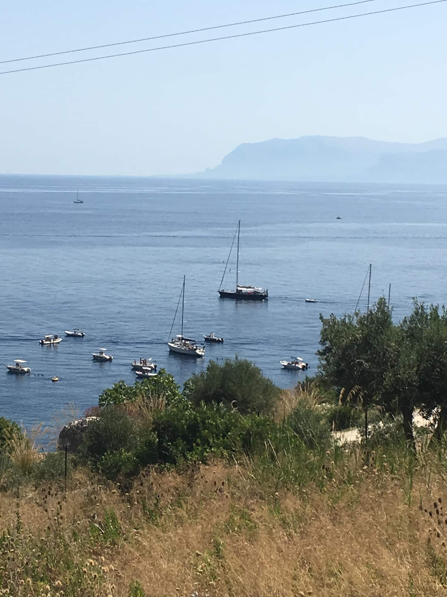 Boats anchored at Scopello. Photo by ConsumerMojo.com