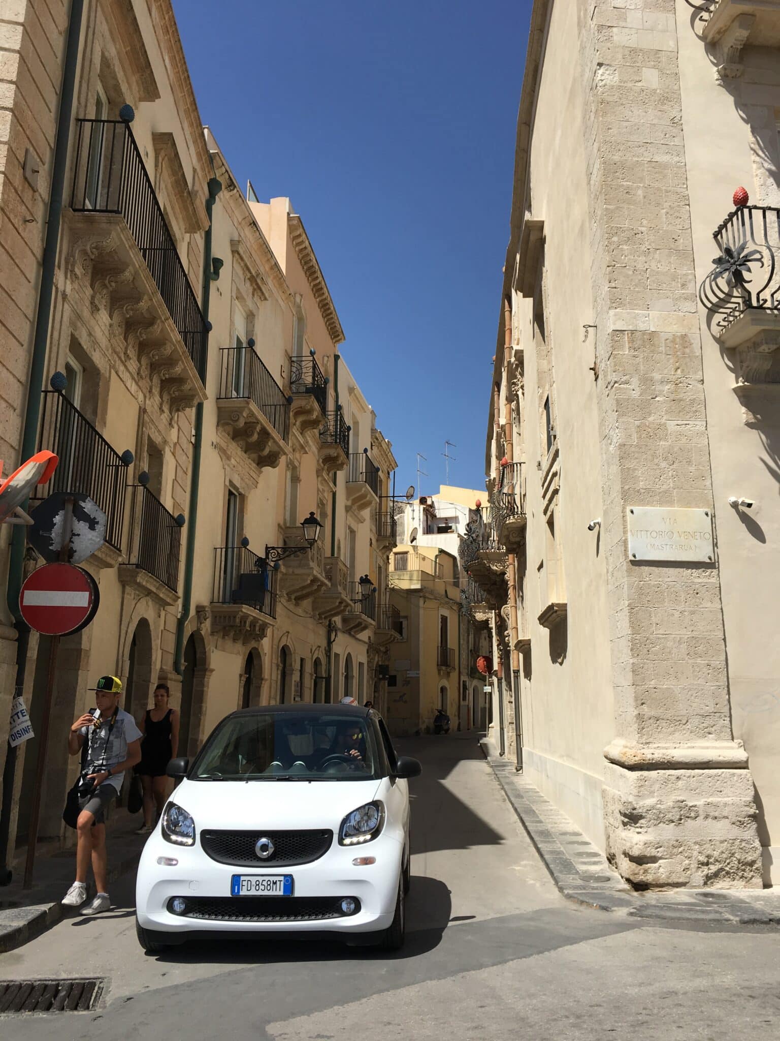 Narrow streets in Ortigia barely allow a car to pass. Photo by ConsumerMojo.com.