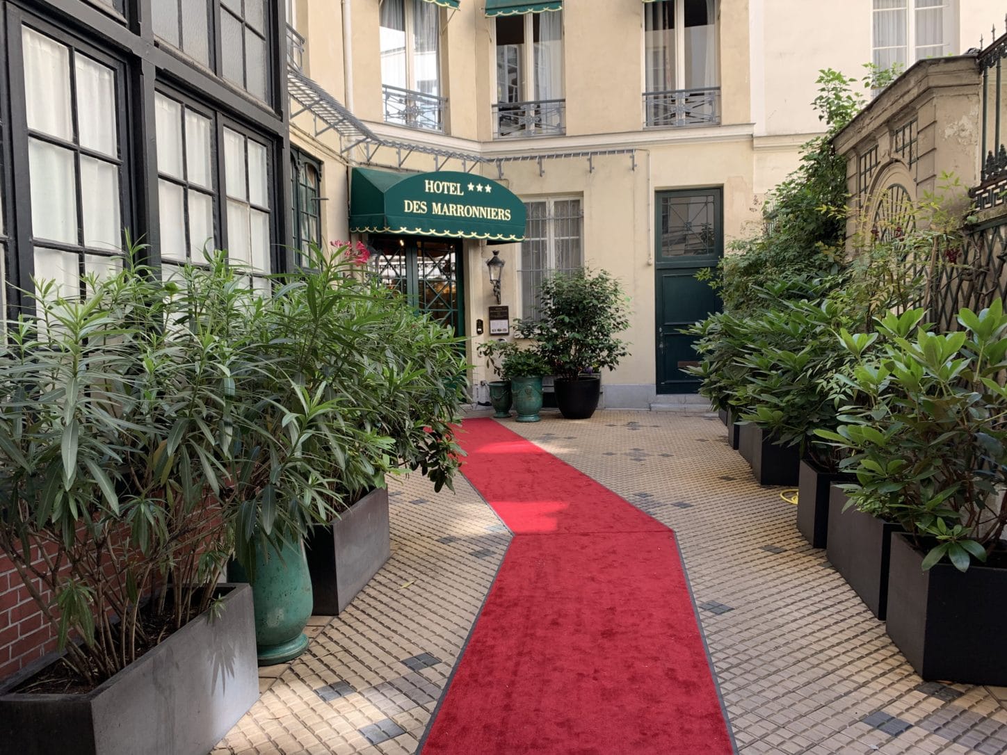 Red carpet entry way of Hotel des Marroniers. Photo by ConsumerMojo.com