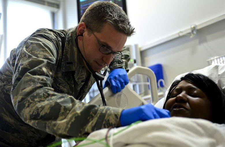 Intensive Care Unit, Air Force doctor simulates examination of a patient in ICU