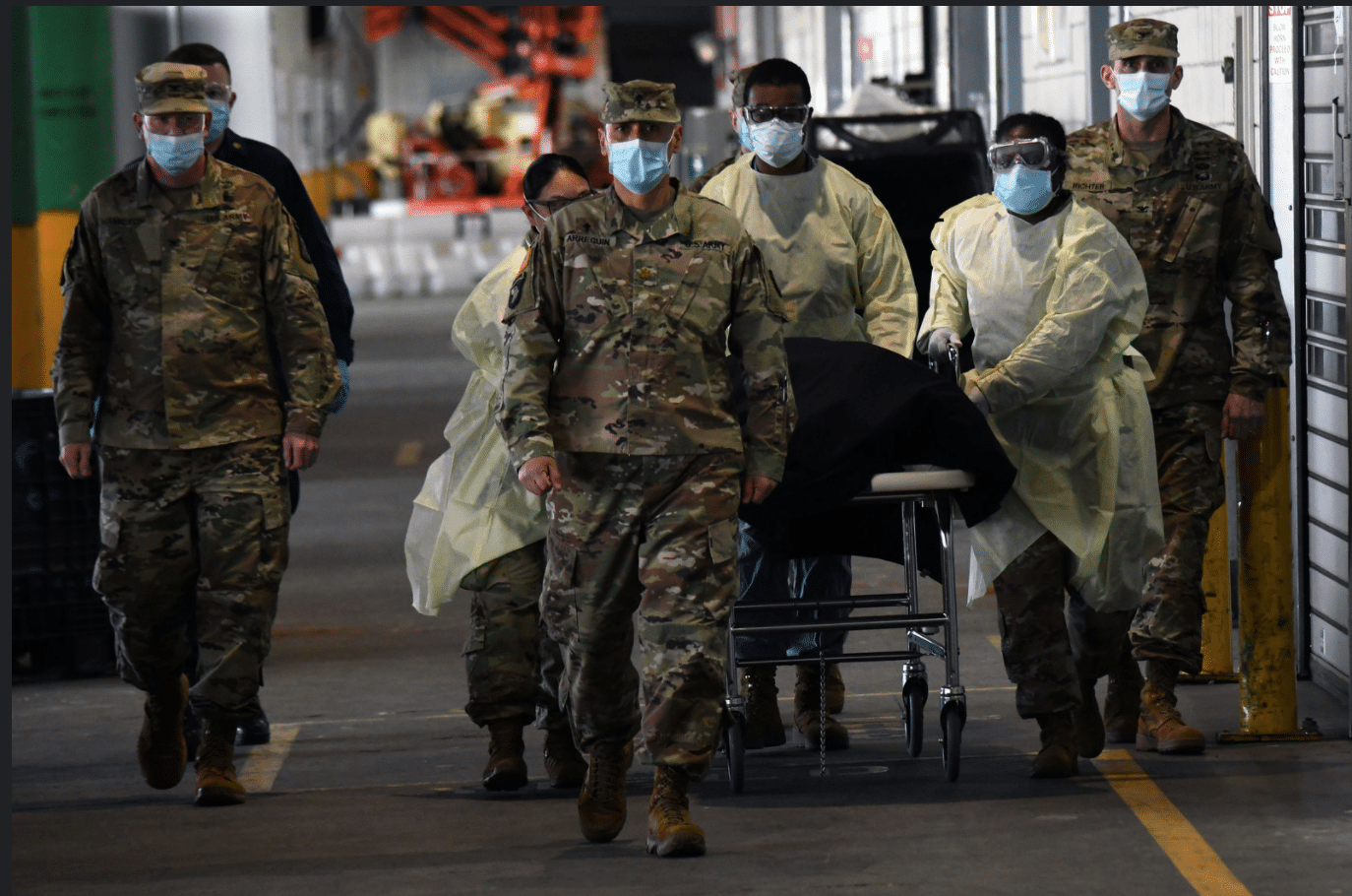 U.S. Army Chaplain and Healthcare Workers Escorting A Covid-19 Victim