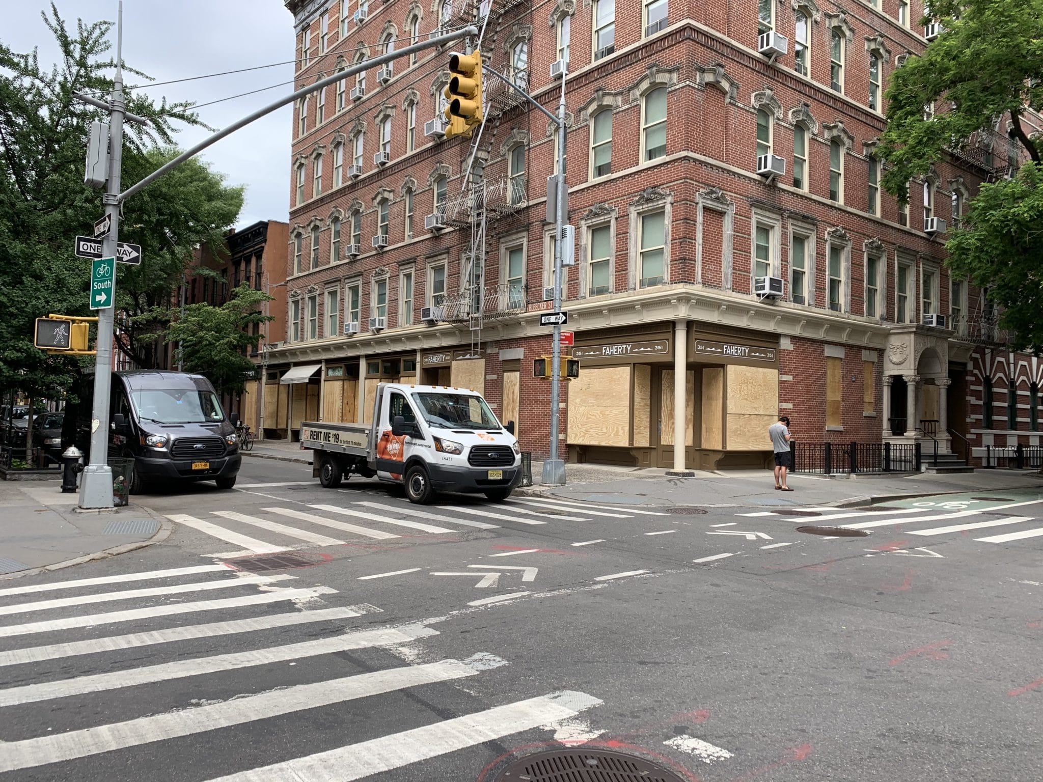 Iconic Bleecker Street with stores boarded up.
