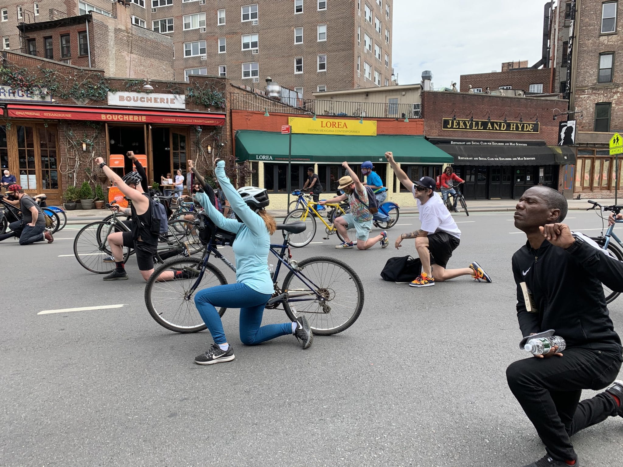 Protestors taking a knee at Sheridan Square