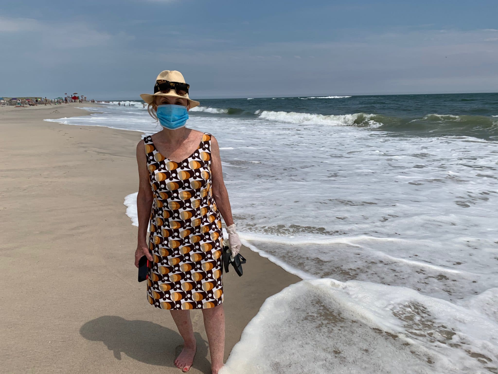 Barbara Nevins Taylor with the surf at Robert Moses State Park, Babylon, New York. Photo by ConsumerMojo.com