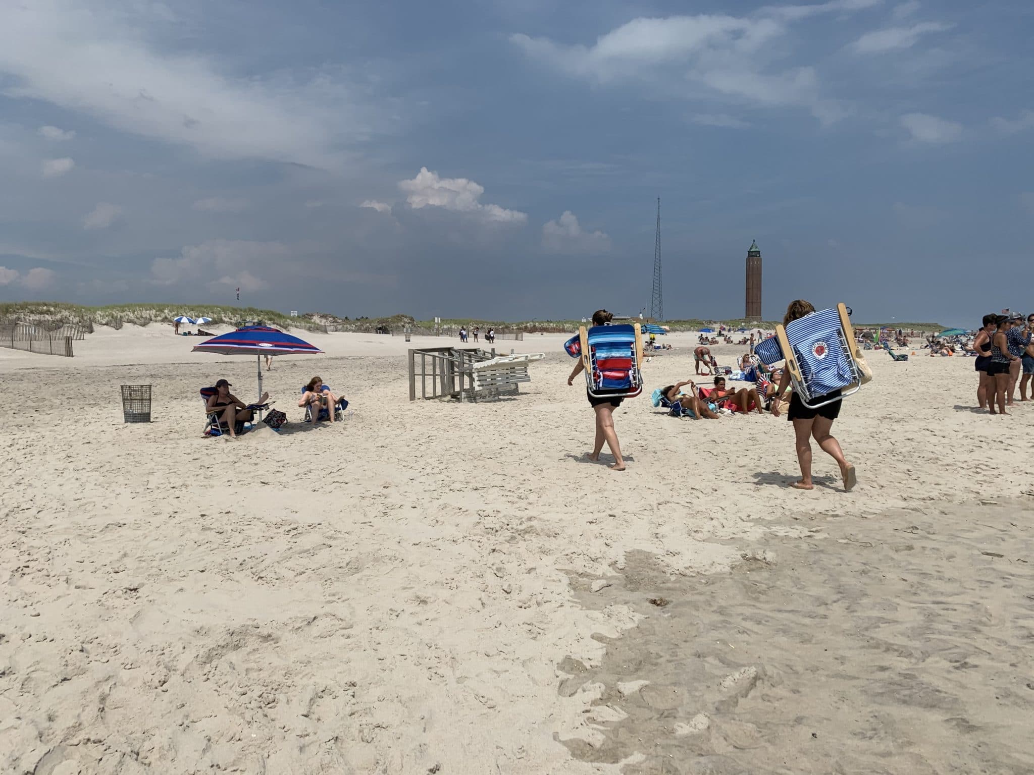 People lounging, standing and not wearing masks on the beach at Robert Moses State Park, Babylon Long Island. Photo by ConsumerMojo.com