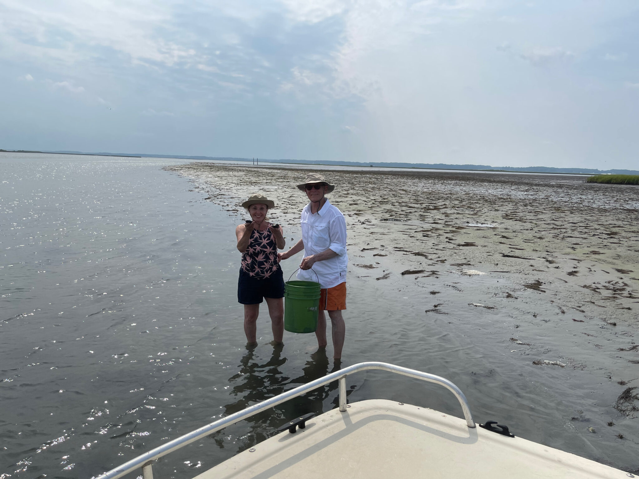 Barbara Nevins Taylor and Nick Taylor with a bucket of clams. Photo by ConsumerMojo.com 