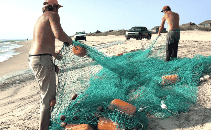 Fishermen with nets on the beach at Nag's Head, North Carolina. Photo by ConsumerMojo.com