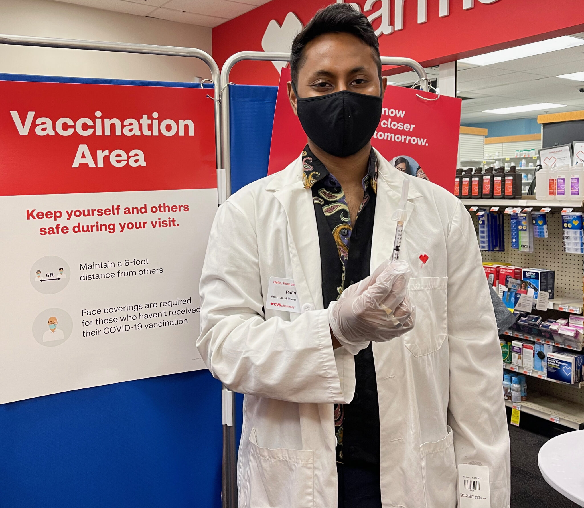 Rafin Islam, Pharmacist at CVS with the Moderna COVID Vaccine Booster