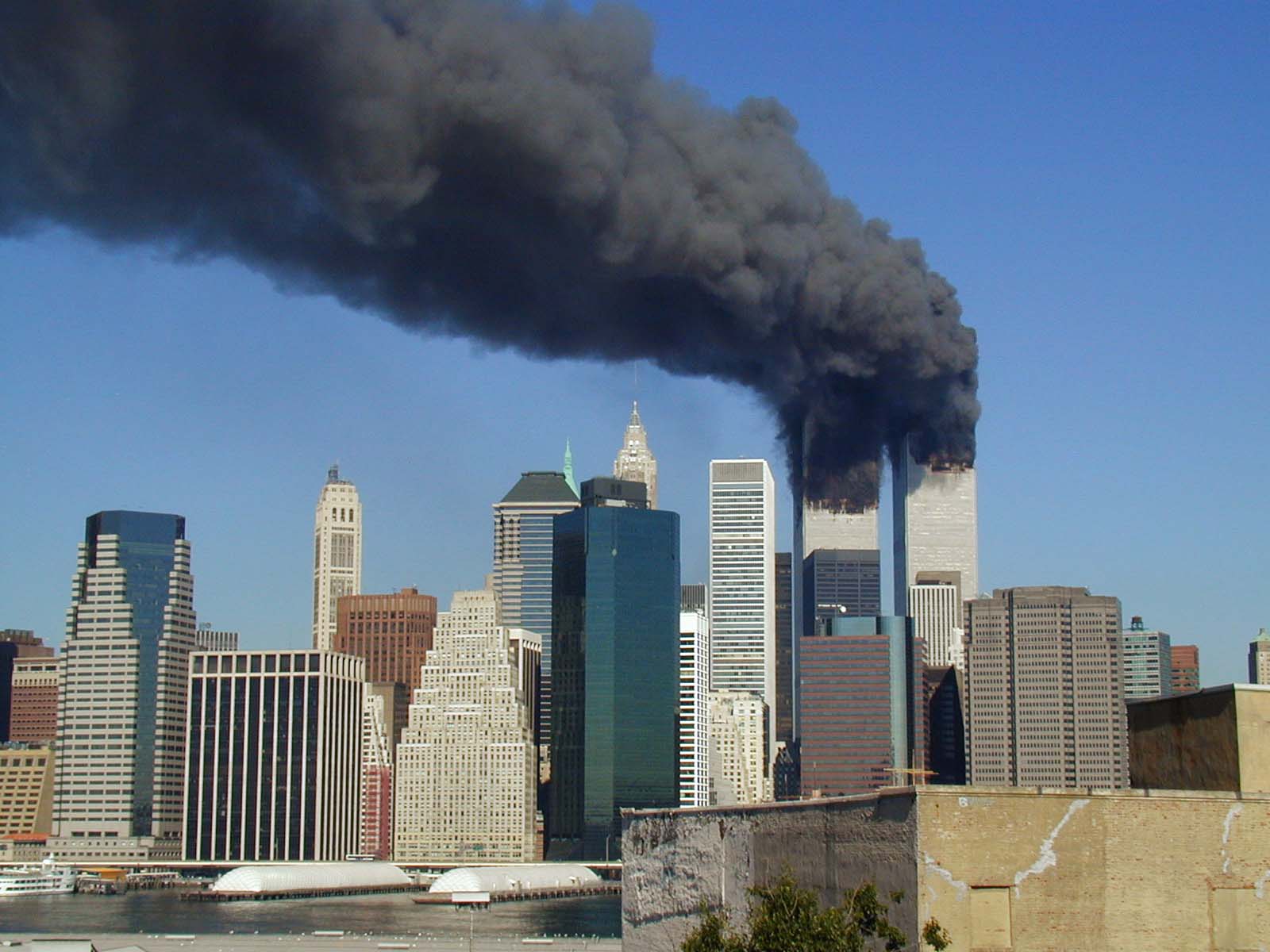 World Trade  Towers smoking after attack. Photo by Michael Foran, via Flickr, Wikimedia