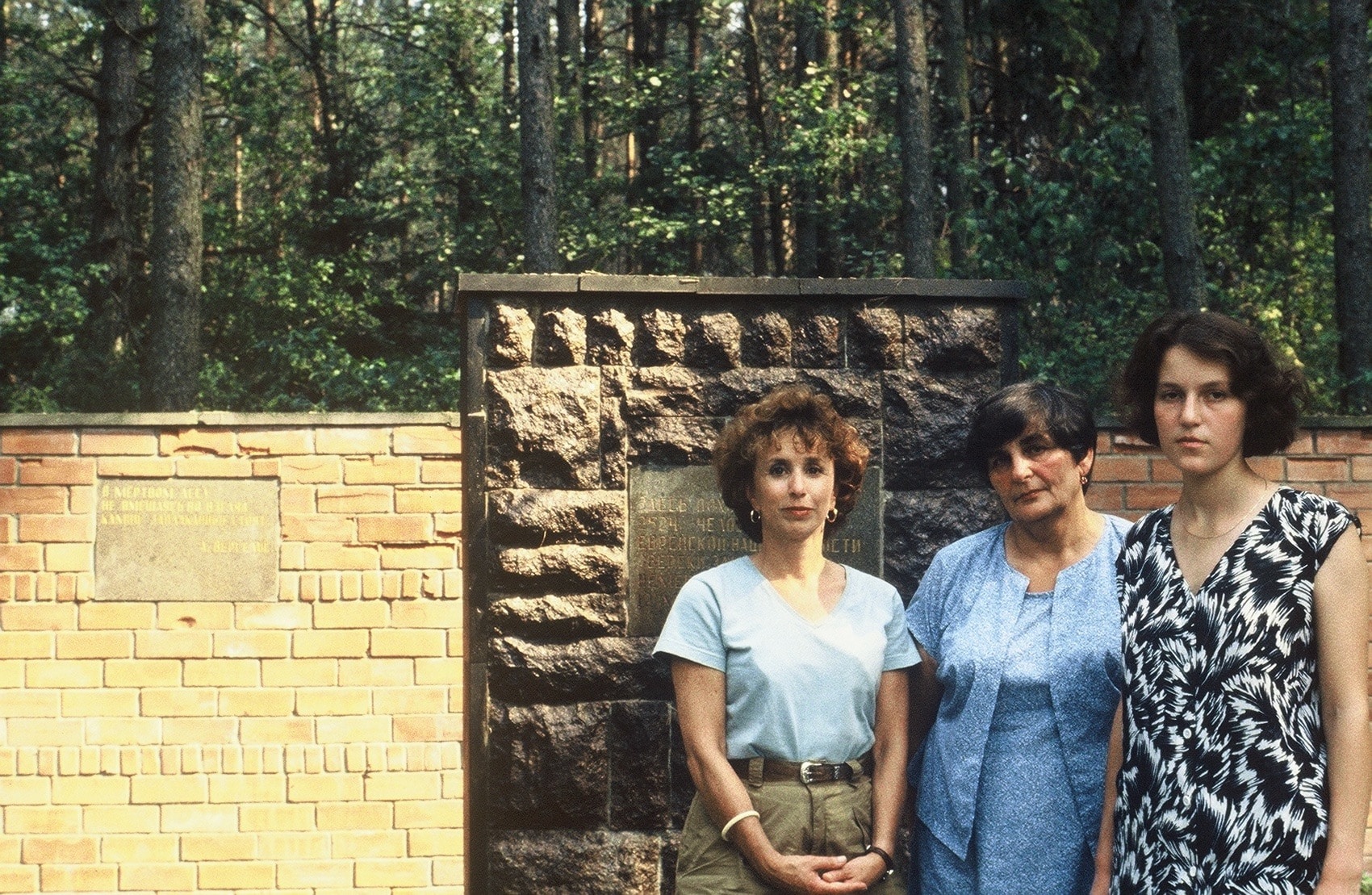 Barbara Nevins Taylor, Maria Shapira and her granddaughter at the mass grave of slaughtered Jews in Ivye, Belarus