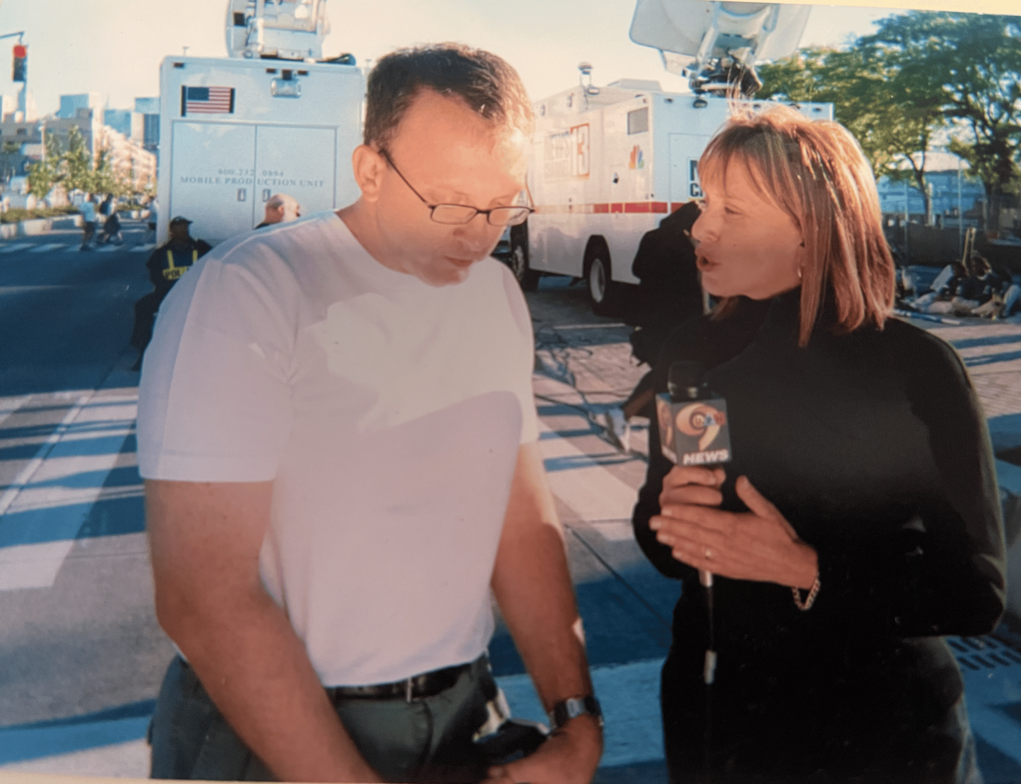 Barbara Nevins Taylor interviewing a man after 9/11