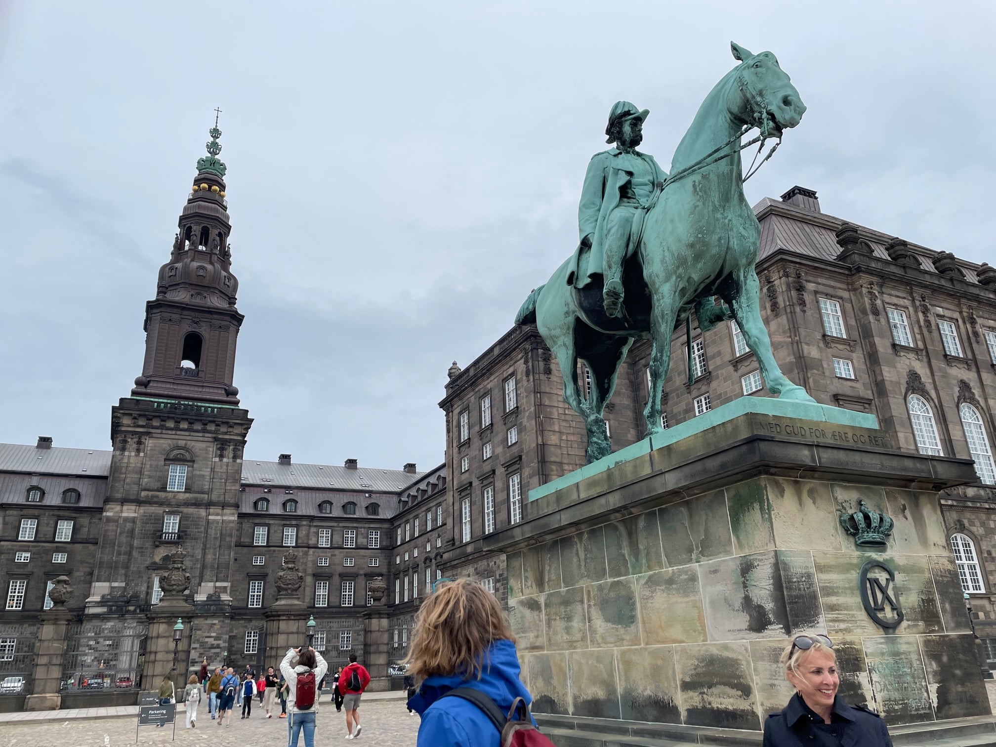 Barbrara Nevins Taylor and the statue of the king in front of Borgen in Copenhagen