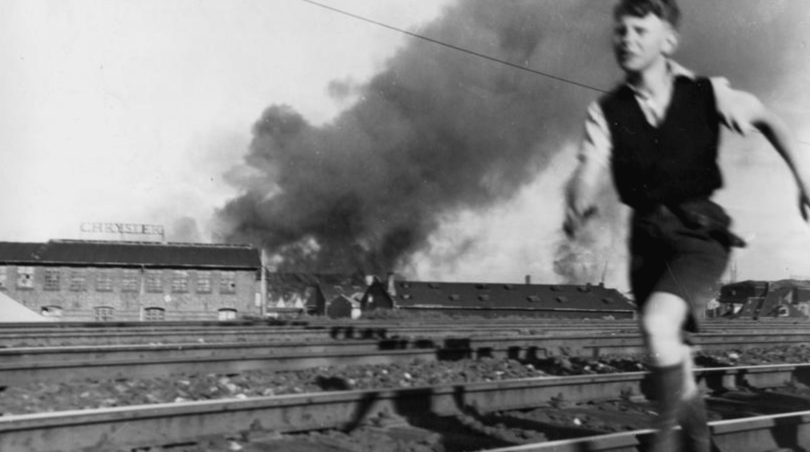 Boy in Copenhagen running after a bomb blast. Photo courtesy of the Museum of the Danish Resistance