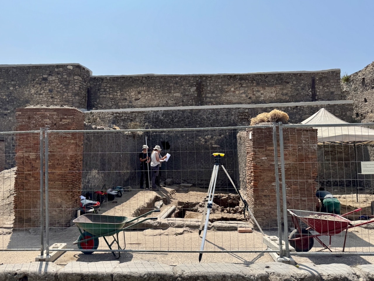 Archeologist practicing at a dig in Pompeii. Photo by ConsumerMojo.com