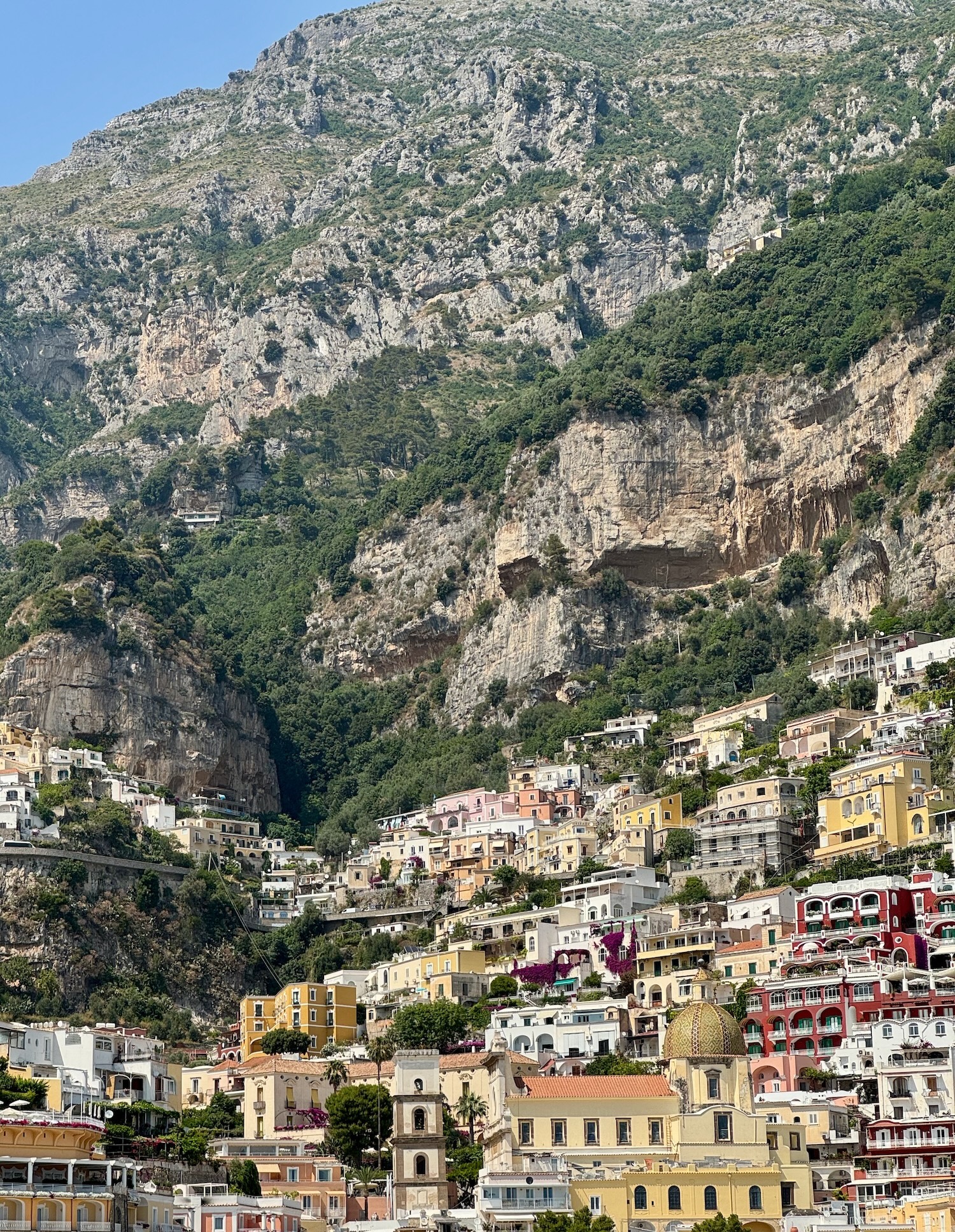 Massive mountain seems to dwarf Positano. Photo by ConsumerMojo.com