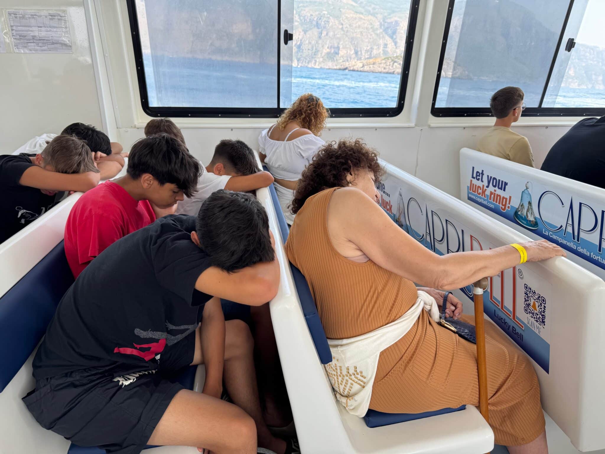 Sleeping students on the boat to Amalfi Coast. Photo by ConsumerMojo.com