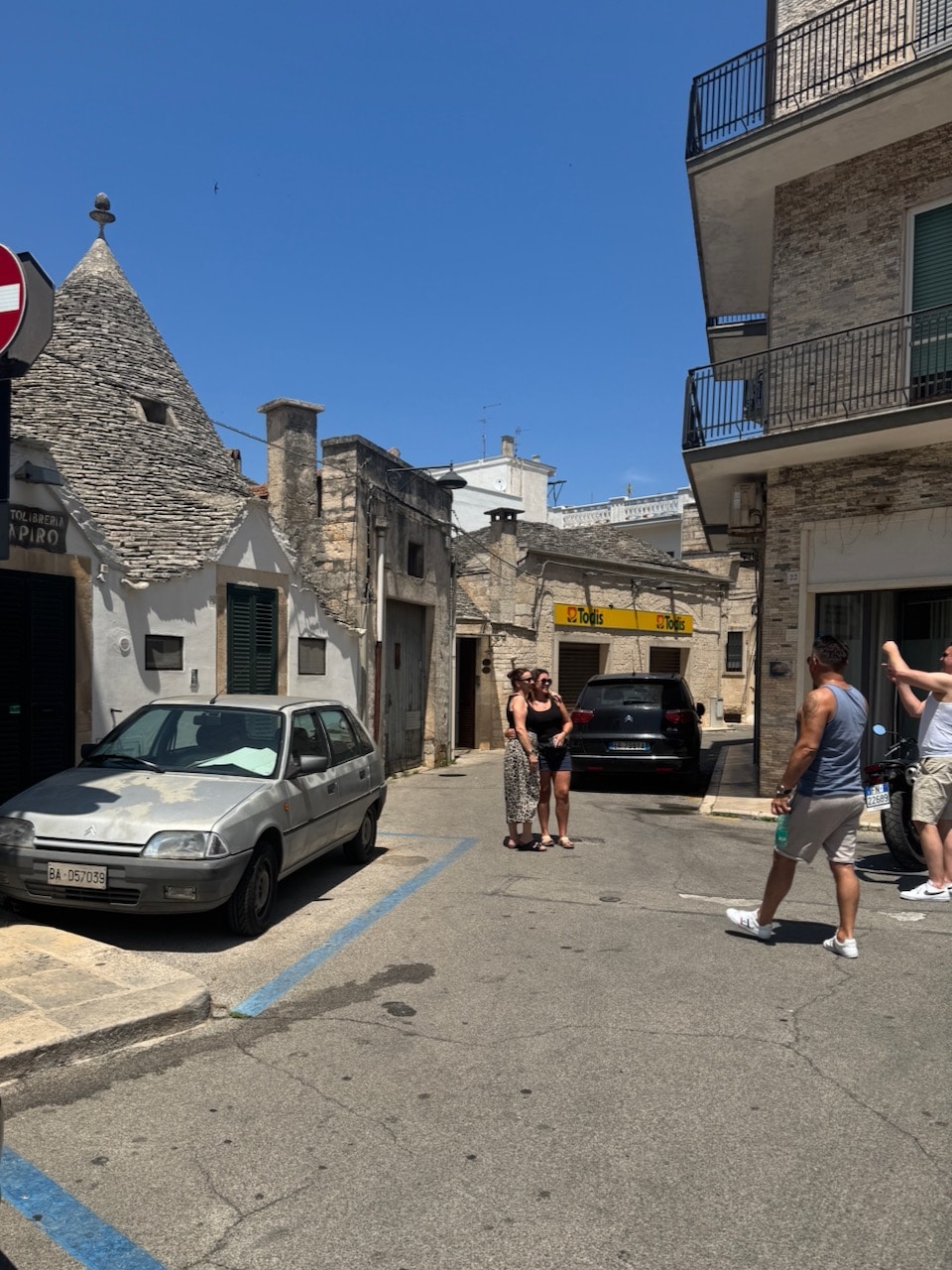 ourists taking photos in Alberobello