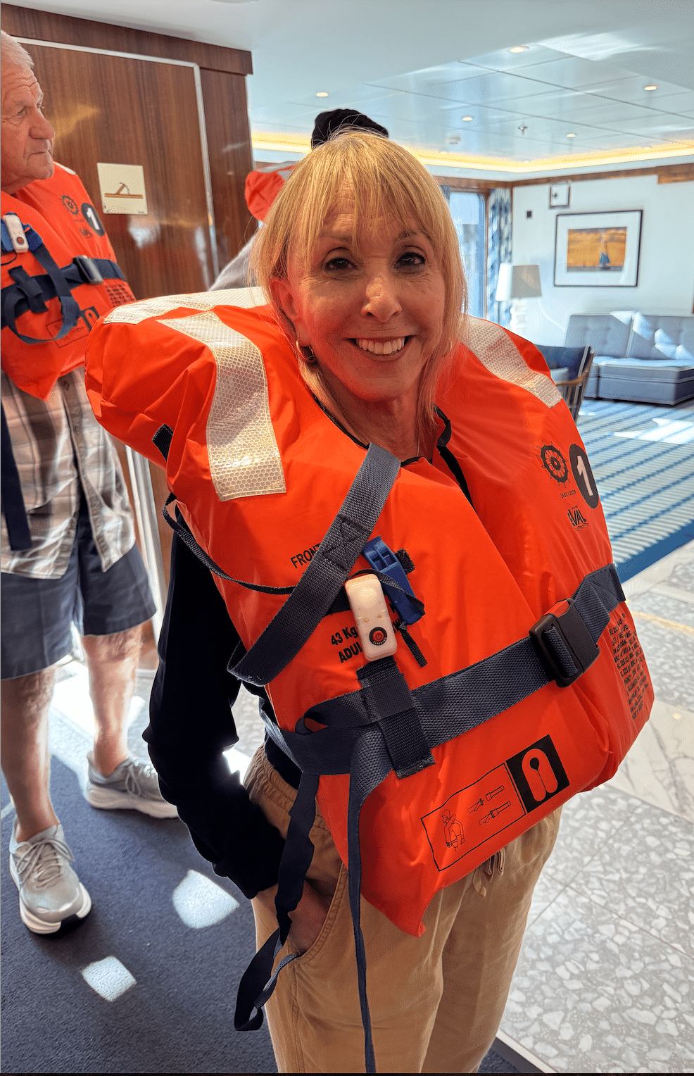 Barbara Nevins Taylor in life jacket aboard Atlas World Traveller. Photo by ConsumerMojo.com 