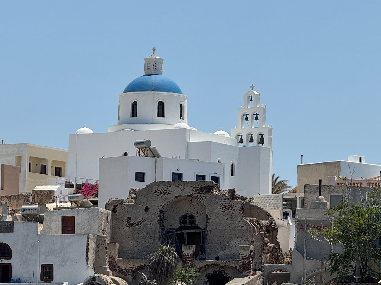 Church with bells and blue Dome, Oia, Santorini. Photo by ConsumerMojo.com