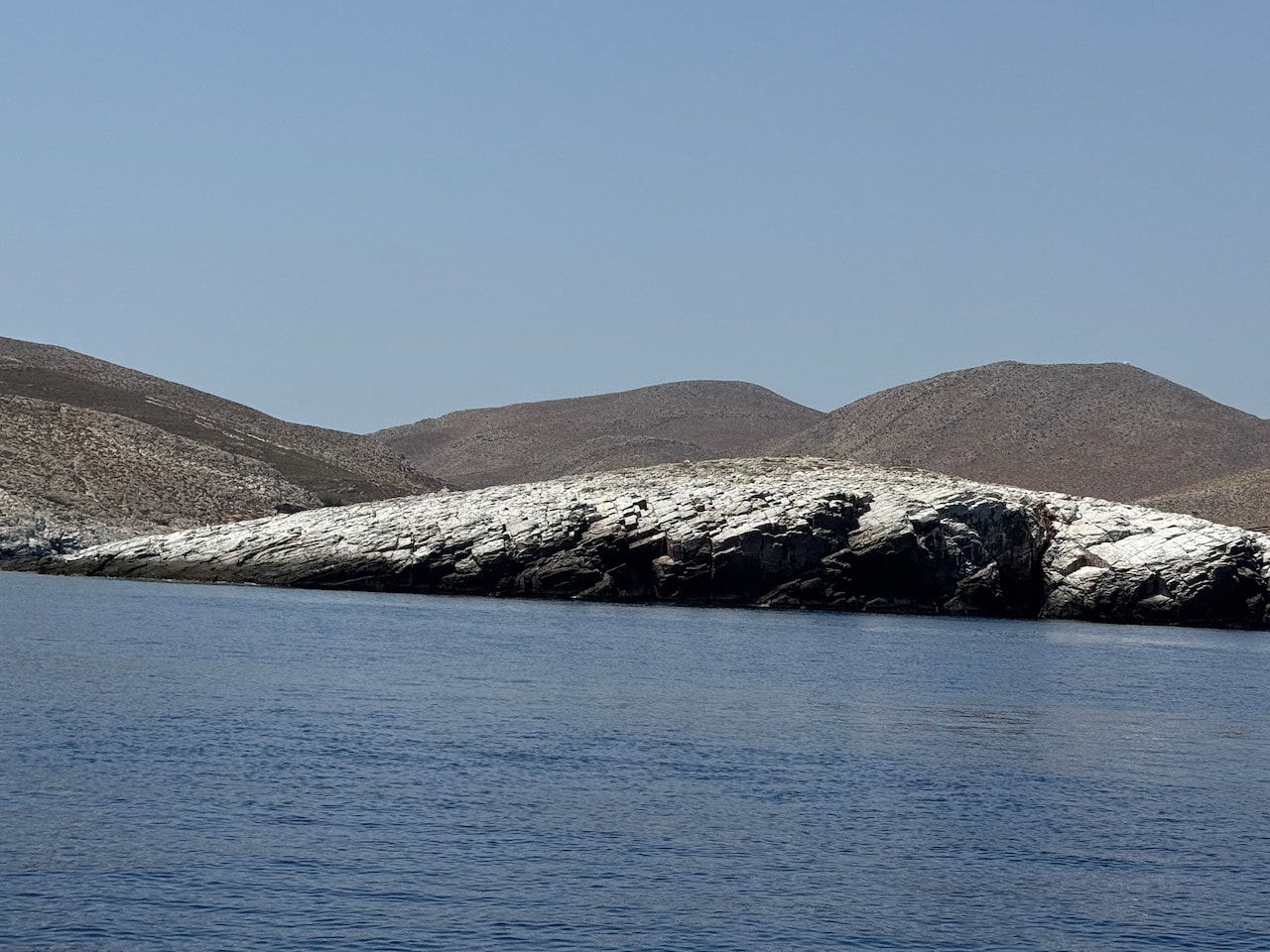 Folegandros from the sea. Photo by Consumer Mojo. com
