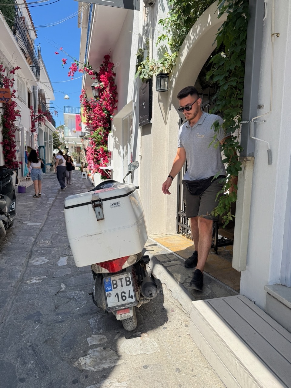 Guy making a delivery in Skiathos. Photo by ConsumerMojo.com