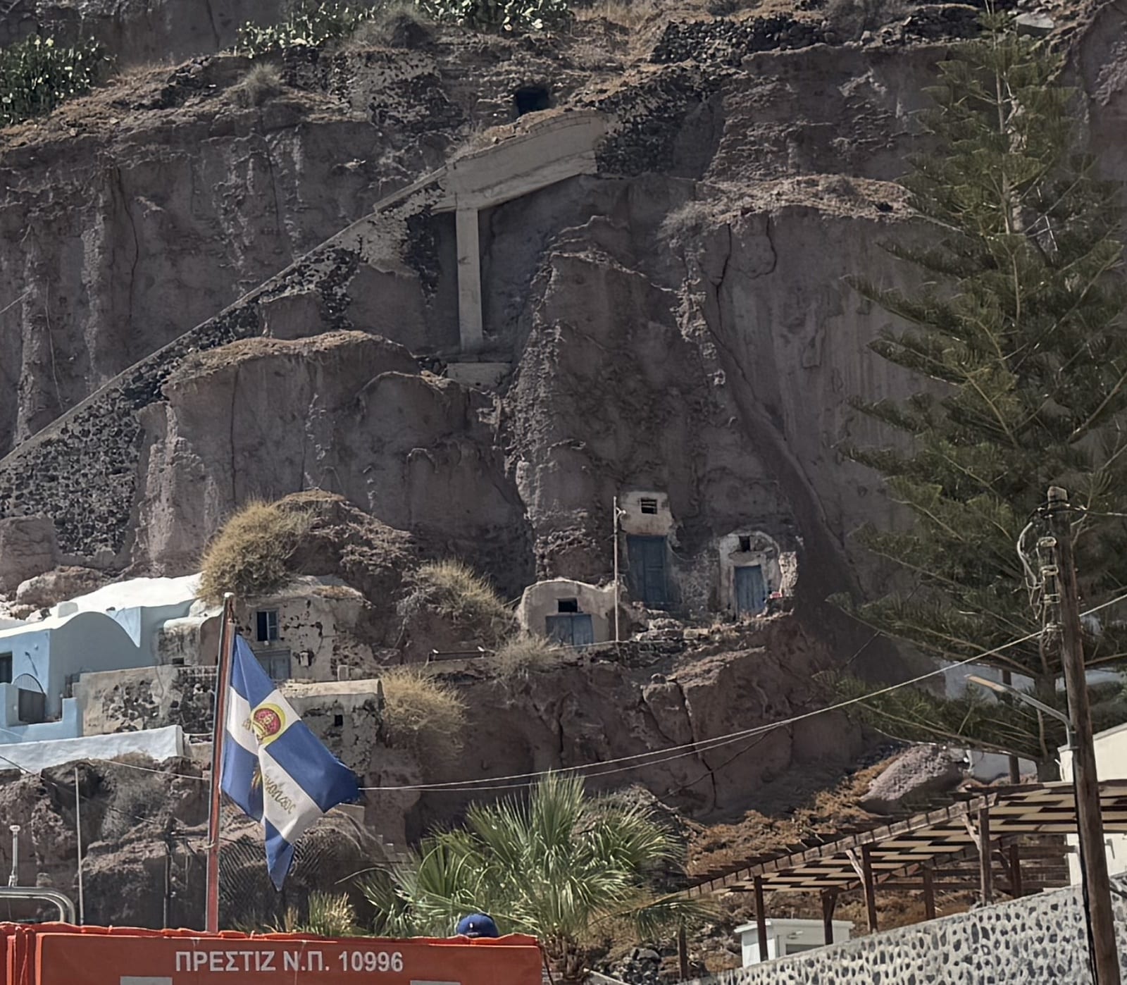 Cave dwellings built into the cliffside at Fira, Santorini, Greece.