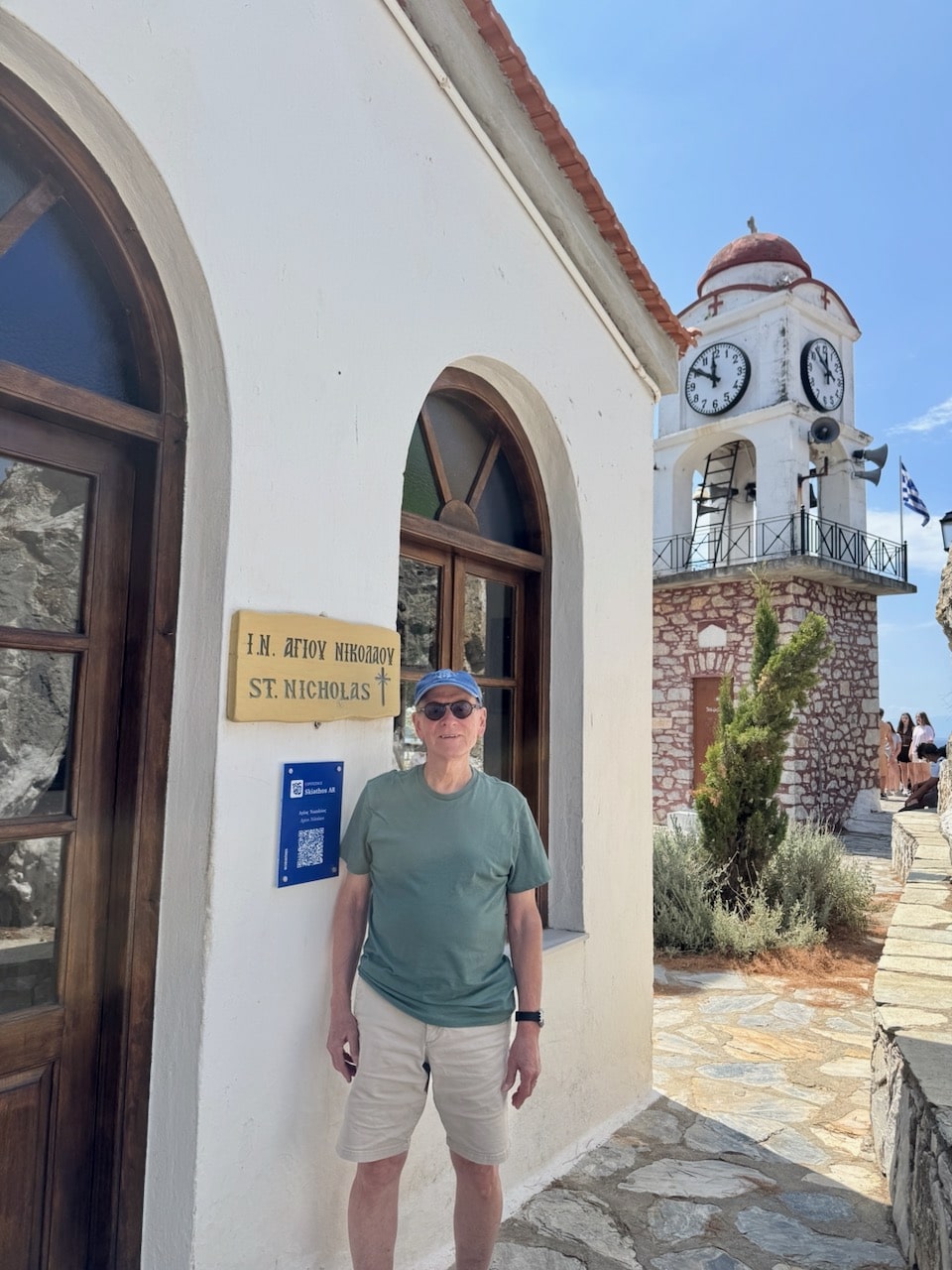 Nick Taylor and St. Nicholas Church and clock tower on Skiathos. Photo by ConsumerMojo.com