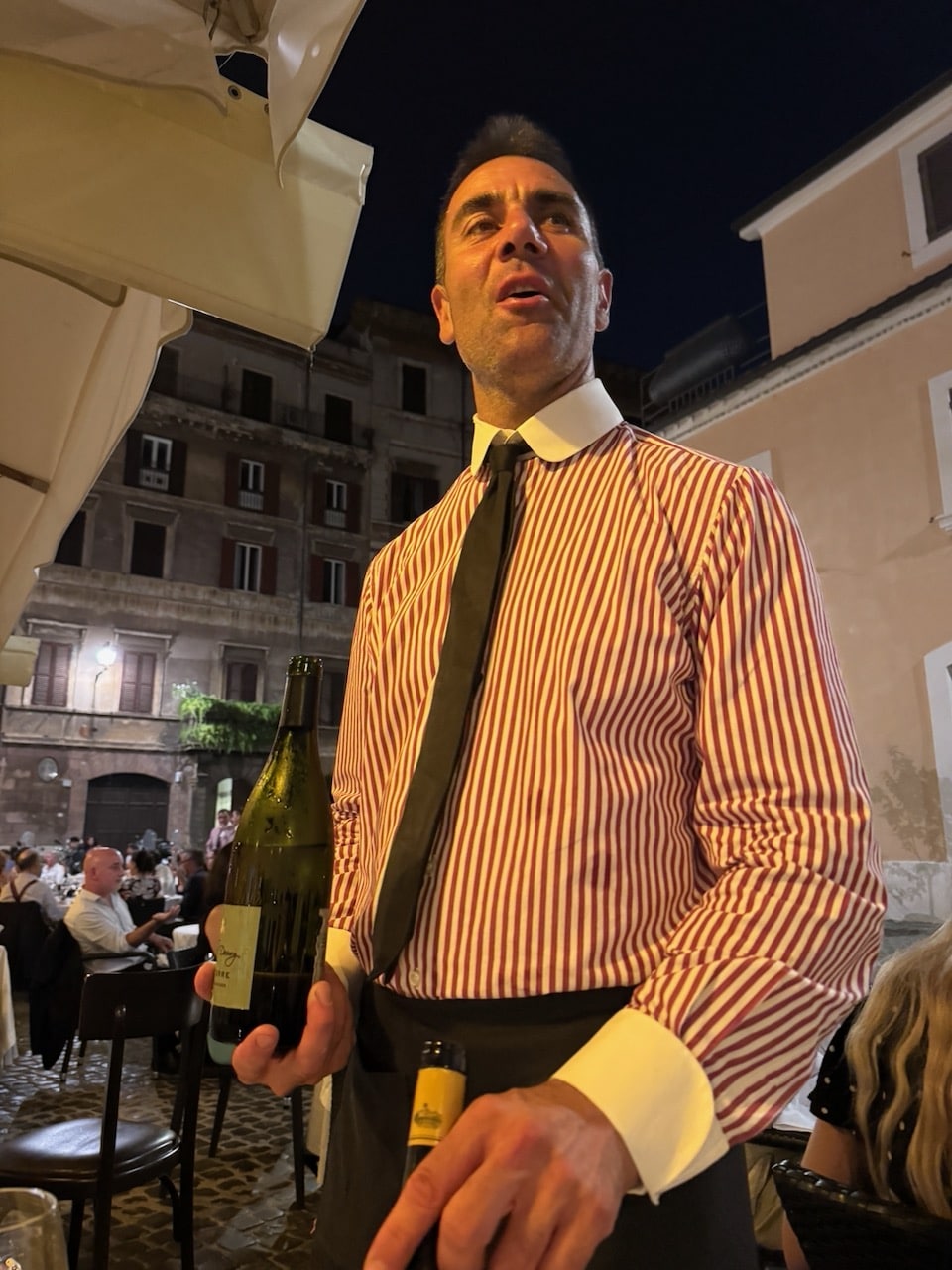 Waiter at Pier Luigi in tie and collar. Photo by ConsumerMojo.com