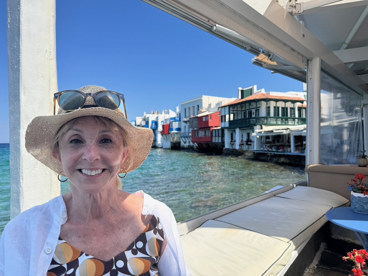 Barbara Nevins Taylor at restaurant in Little Venice on Mykonos. Photo by ConsumerMojo.com.