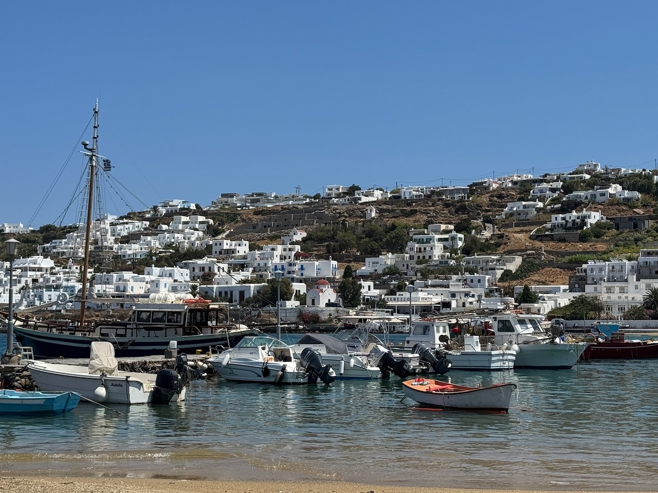 Small boats in the Harbor in Mykonos. Photo by ConsumerMojo.com