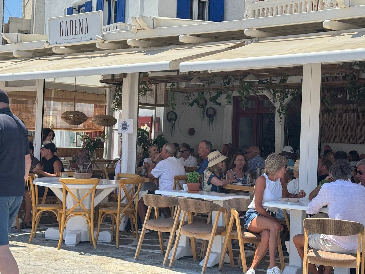 Tourists at a taverna in Mykonos. Photo by ConsumerMojo.com
